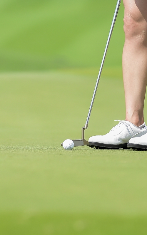 golfer-putting-golf-ball-on-the-green-golf-2023-02-15-00-45-45-utc-scaled.jpg