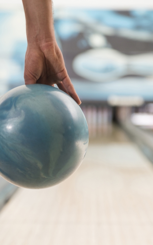 man-about-to-push-the-bowling-ball-2021-08-26-20-15-17-utc-scaled.jpg